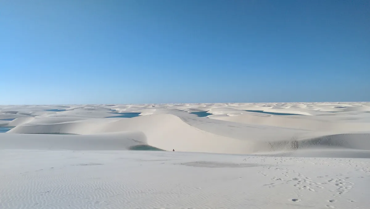 Experience the wonder of Lençóis Maranhenses, Brazil's unique landscape of white sand dunes and crystal-clear lagoons. Perfect for adventurers and nature lovers alike.